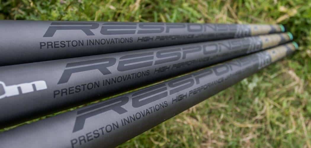 Three carbon pole sections laid on grass showing their matt finish